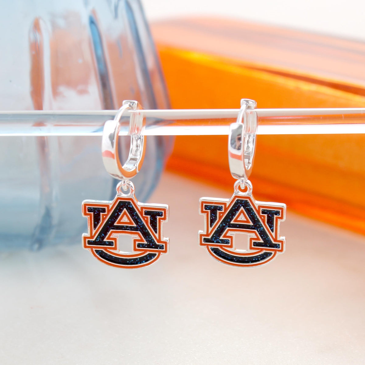 Auburn Glitter Enamel Logo Huggie Hoop Earrings