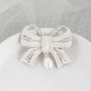 Crystal Bow w/ Dangle Pearl Pendant